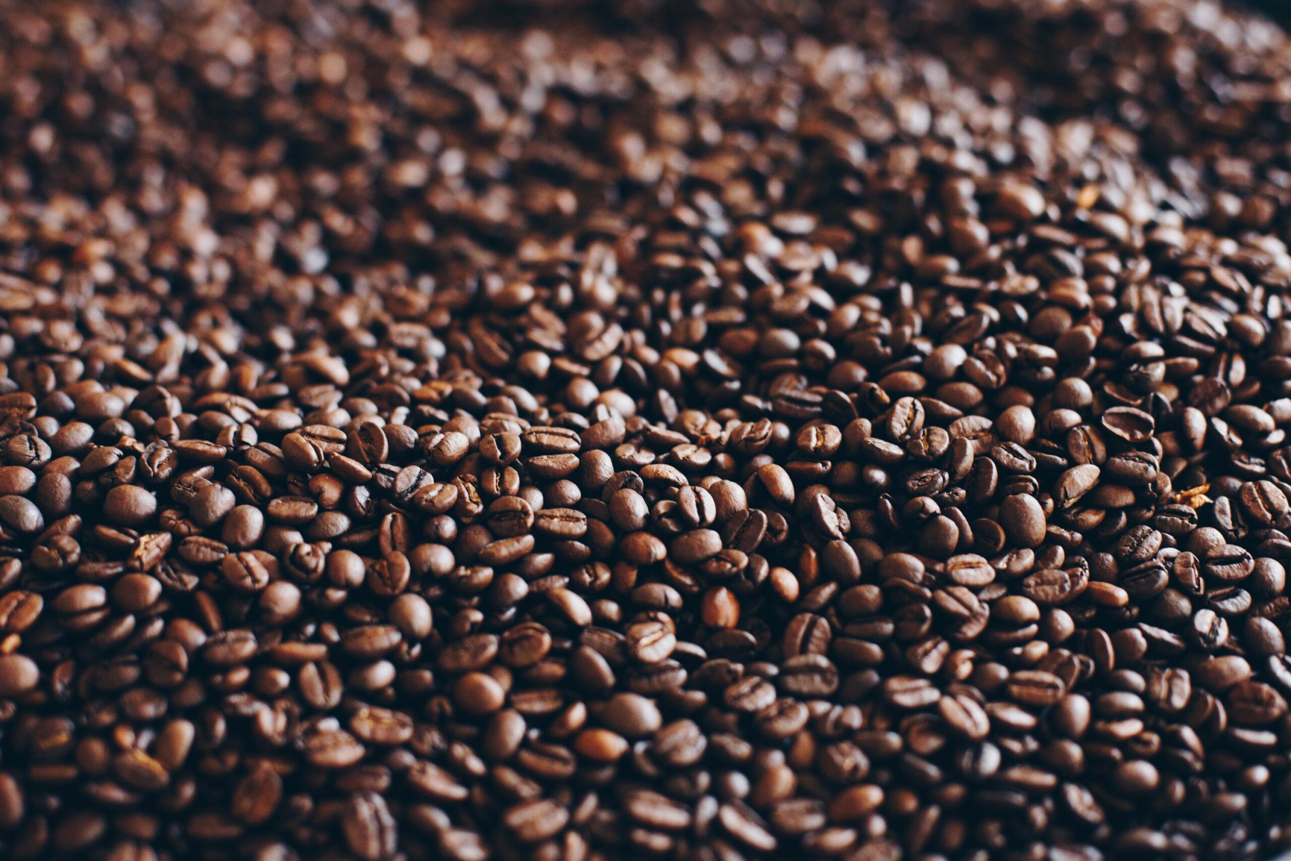 Close-up view of aromatic roasted coffee beans, perfect for caffeine lovers.